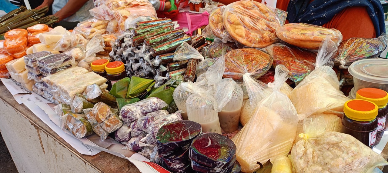 A market stall in Tawi-Tawi piled with rice cakes, sweets and other native delicacies.